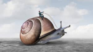 Person riding a snail representing long lead times